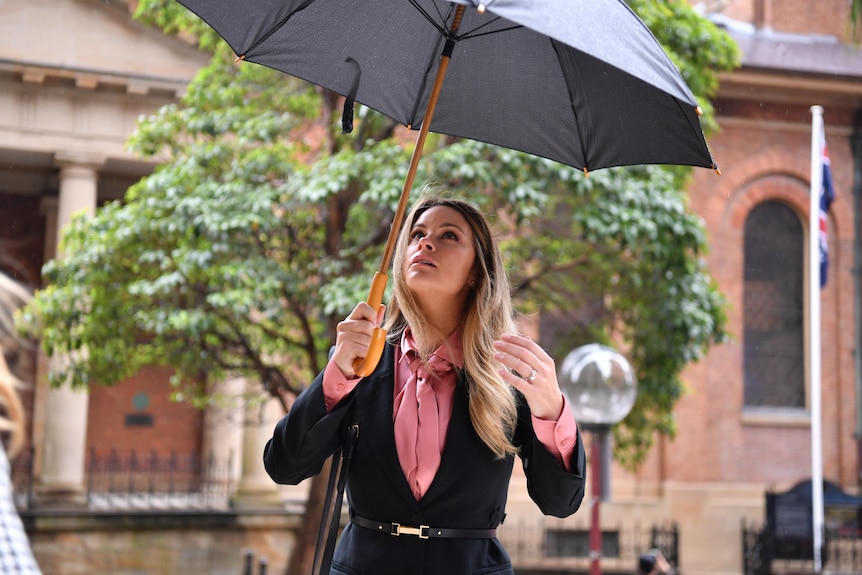 A woman holding an umbrella