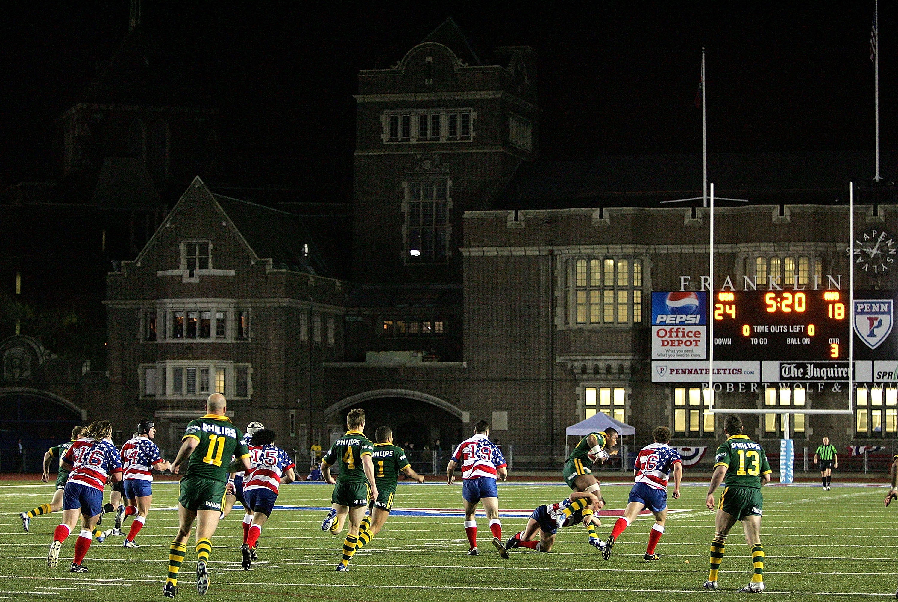 Two rugby league teams play on a gridiron field