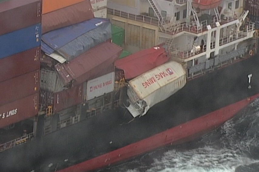 Aerial view of shipping containers on a sea vessel.