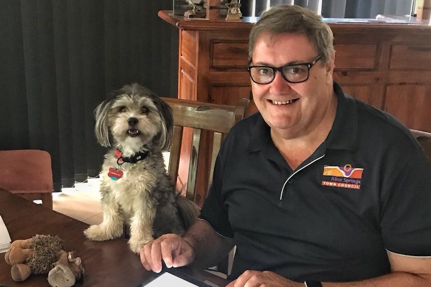 Damien Ryan at home with his dog.