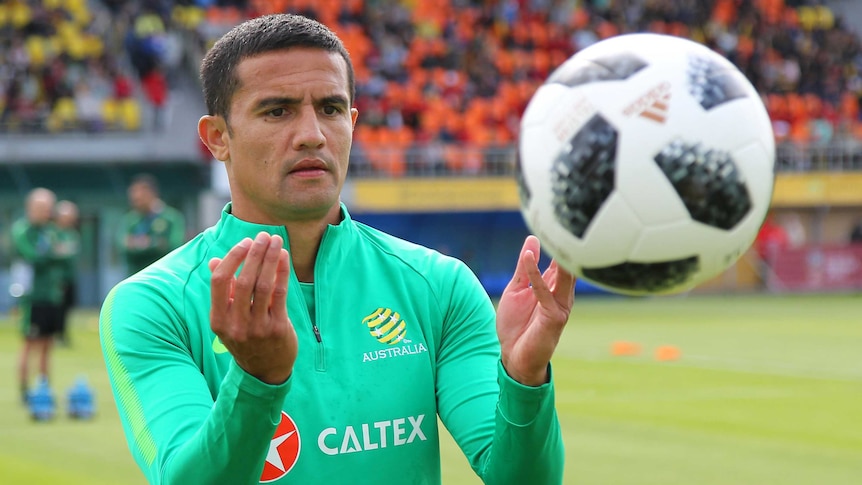 Tim Cahill watches the ball during training