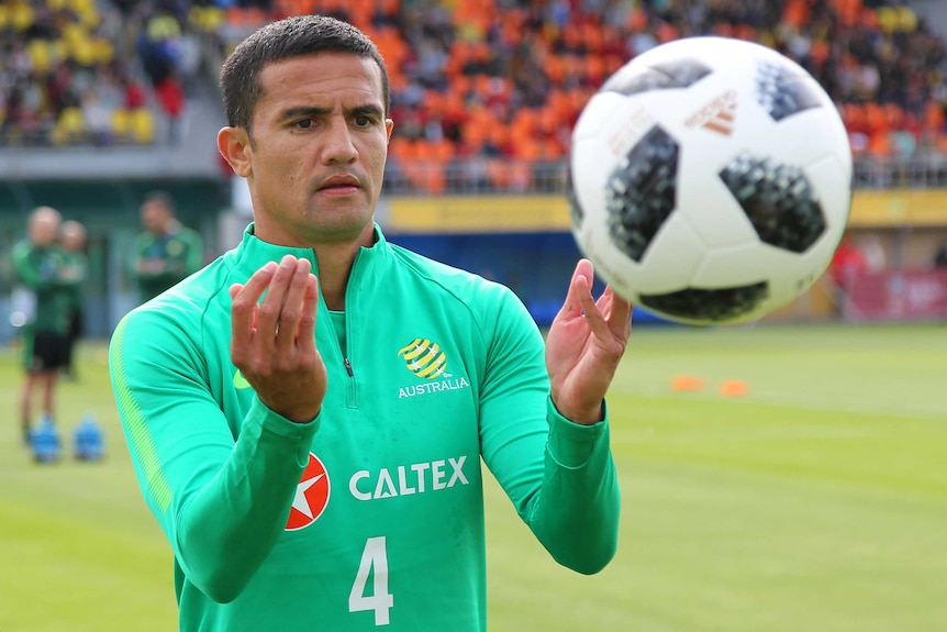 Tim Cahill watches the ball during training