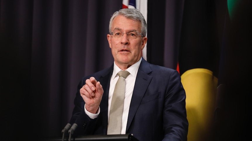 Mark Dreyfus speaks at a lecturn at a press conference
