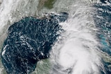 A satellite image of Hurricane Michael, which is heading towards the US state of Florida. Parts of the storm obscure Florida.