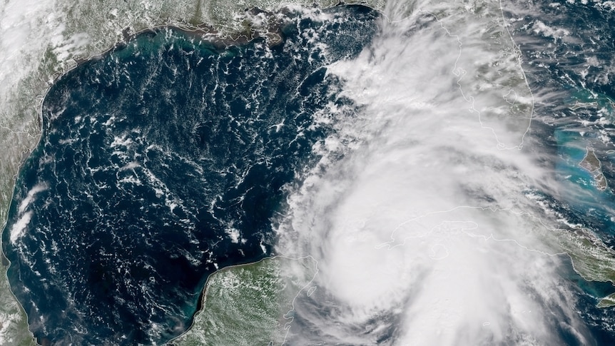 A satellite image of Hurricane Michael, which is heading towards the US state of Florida. Parts of the storm obscure Florida.