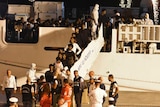 Migrants disembark from the Italian Coast Guard ship "Diciotti".