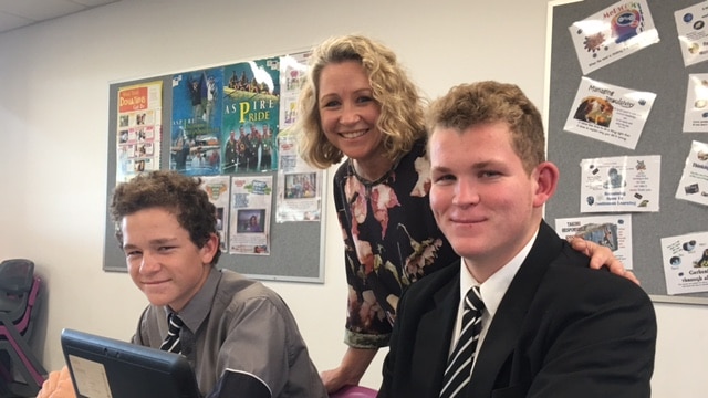 Charmaine Stevens with her sons Flynn, 14, and Darcy, 16, at Iona College