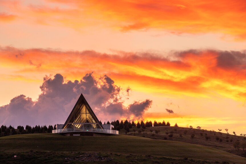 A sunset over visitor's centre at the National Arboretum.