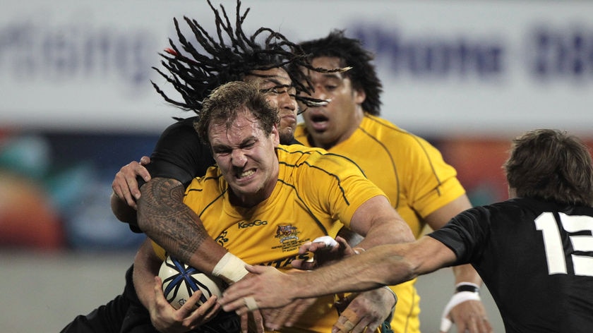 Wallabies skipper Rocky Elsom is taken down by All Black Ma'a Nonu in Christchurch