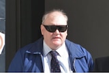 John Joseph Farrell walks out of court