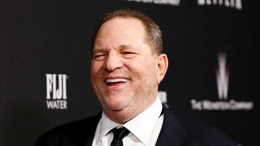 Weinstein laughs on the red carpet of the Golden Globes after party in 2014.