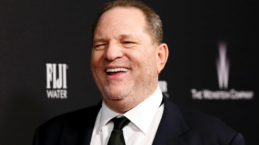 Weinstein laughs on the red carpet of the Golden Globes after party in 2014.