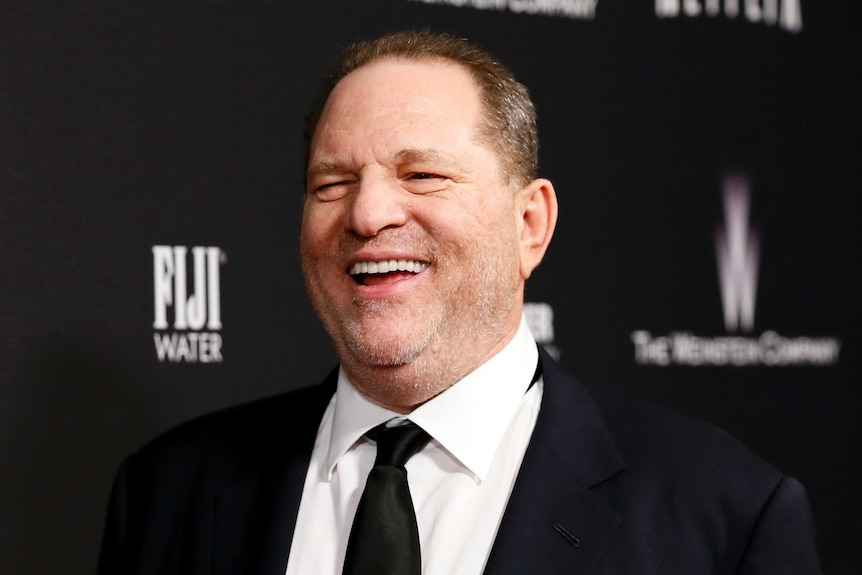 Weinstein laughs on the red carpet of the Golden Globes after party in 2014.