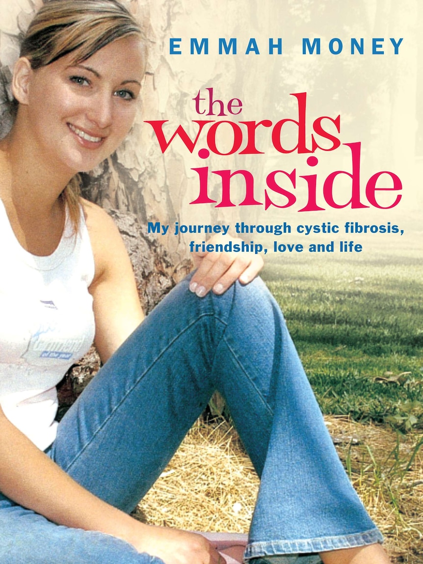 A book cover depicts a teenager sitting on the grass.
