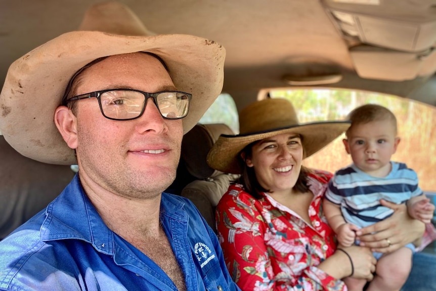 Steve and Bec Eyres in their car with the mother holding her baby