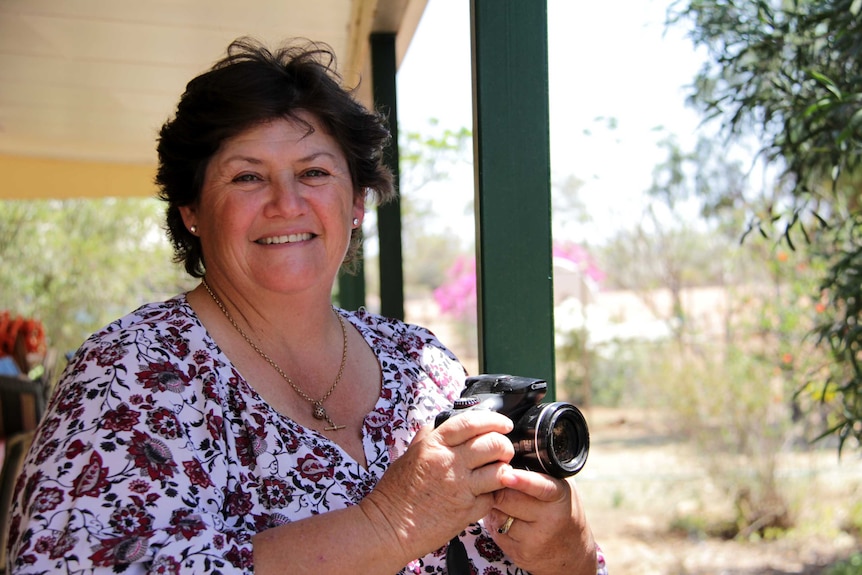 Jenny Gordon on the front deck of her house, west of Longreach in western Queensland.