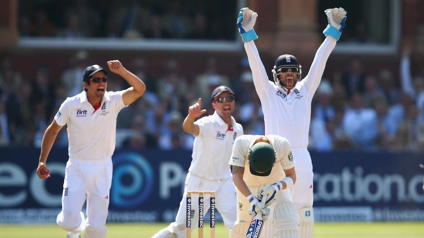 Key wicket ... England celebrates after Joe Root dismisses Michael Clarke