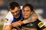 Jarome Luai of the Panthers is tackled by David Klemmer and Aidan Guerra of the Knights during their NRL clash.