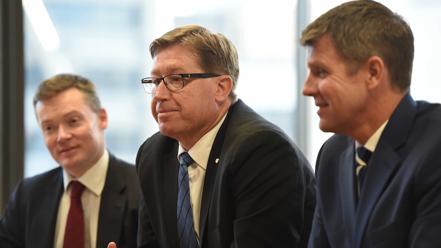 Premier Mike Baird and Deputy Premier Troy Grant at a meeting with greyhound racing officials.