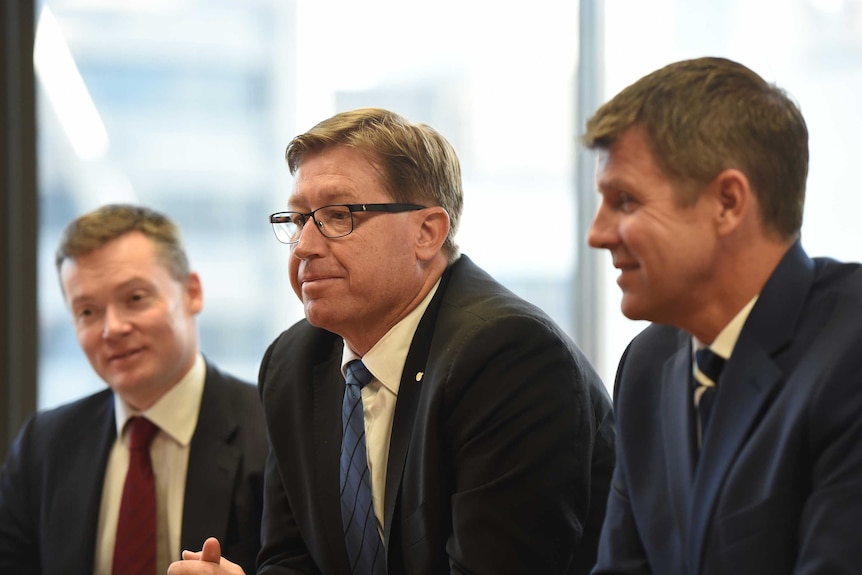 Premier Mike Baird and Deputy Premier Troy Grant at a meeting with greyhound racing officials.