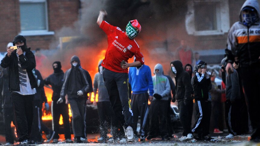 Nationalist Youths throw rocks and petrol bombs at police during rioting in Belfast