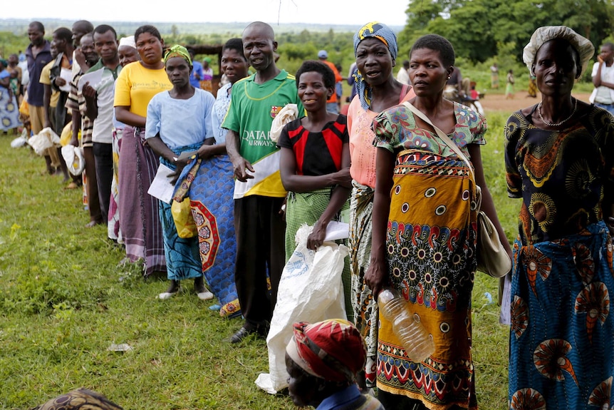 Malawians queue for food aid