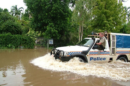 A police car negotiates Katherine flooding