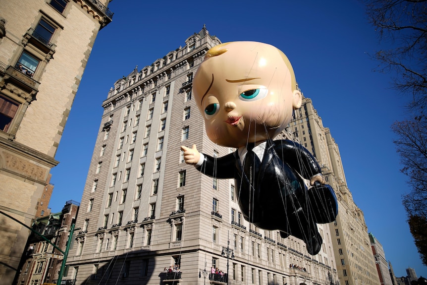 The Boss Baby balloon makes its way down Central Park West