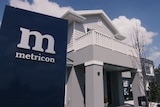 A house with a Metricon sign.
