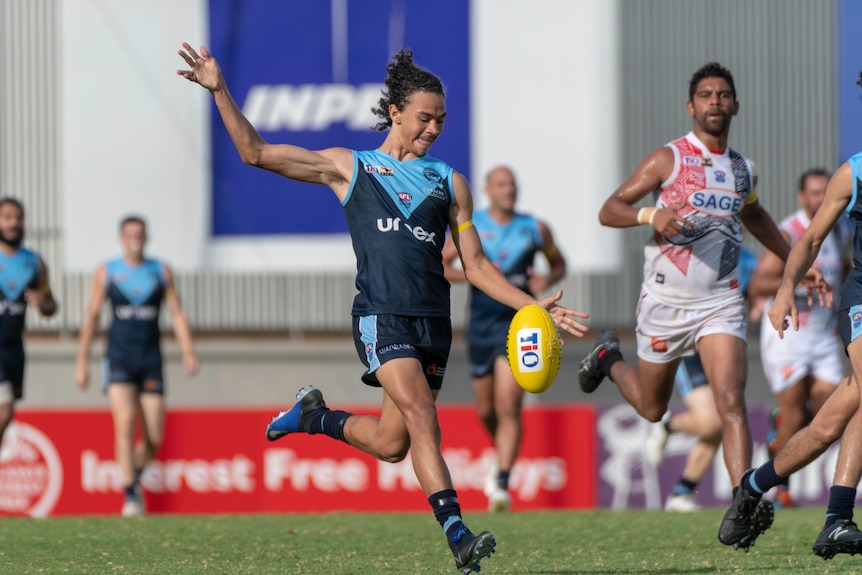 Malcolm Rosas Jnr kicks the ball playing for the Darwin Buffaloes.