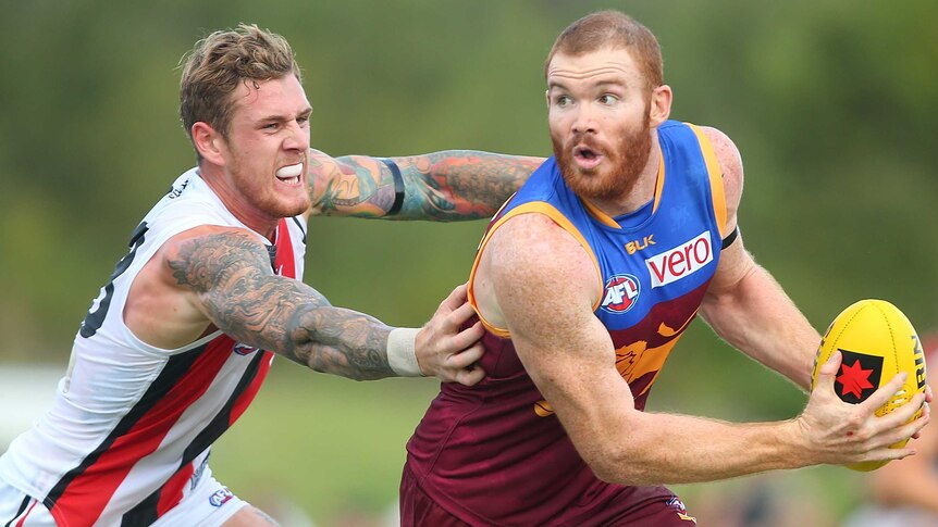 Merrett looks to hand pass