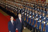 Wen Jiabao and Kevin Rudd review an honour guard at the Great Hall of the People in Beijing.
