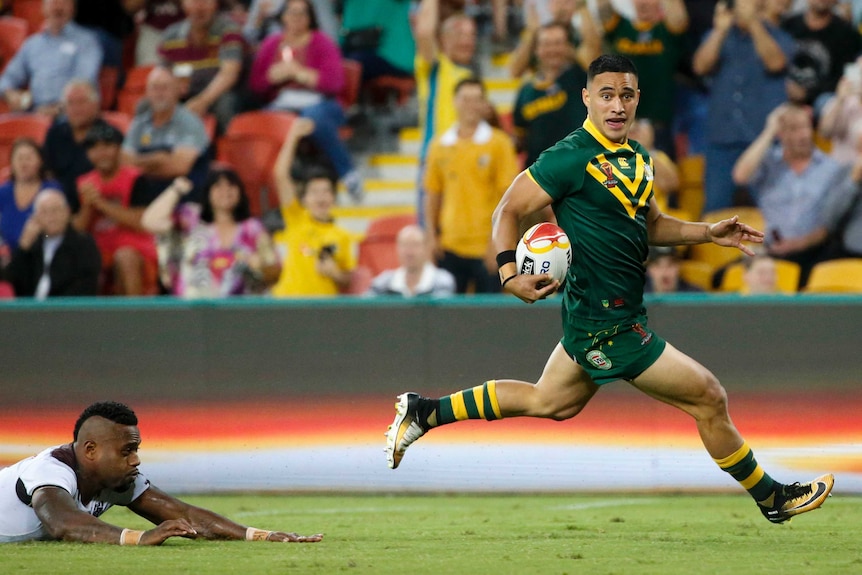 Valentine Holmes scores a try for the Kangaroos against Fiji.
