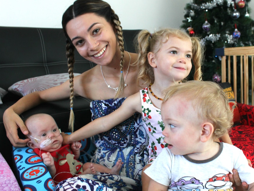 Young mother with three children under three.