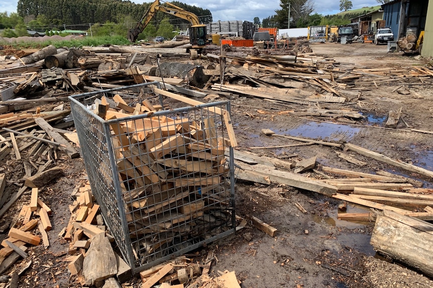 Timber strewn around a sawmill yard after flooding