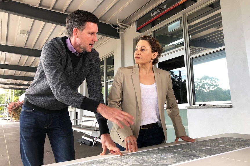 Mark Bailey and Jackie Trad at Nambour Station looking at plans for rail upgrade.