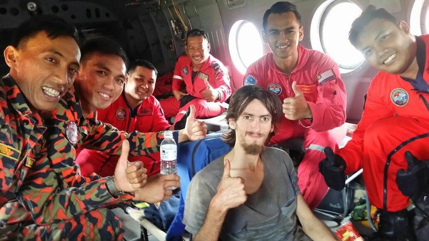 Missing Australian hiker Andrew Gaskell with his Malaysian rescue team
