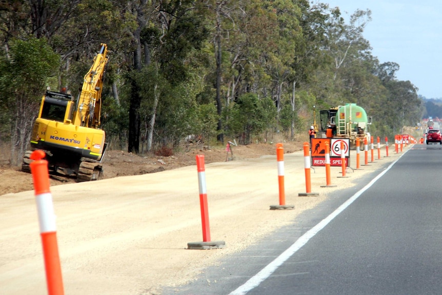 Roadworks beside a highway.