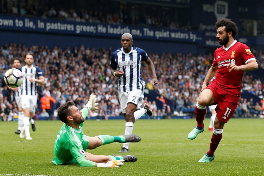 Liverpool's Mohamed Salah scores his team's second goal against West Brom in April 2018.