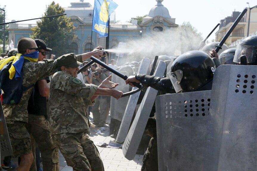 Demonstrators clash with police outside the parliament building in Kiev, Ukraine