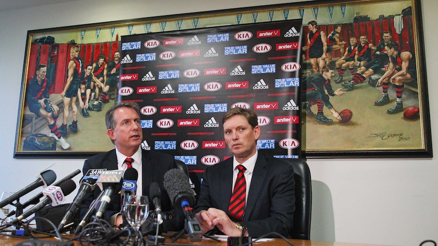 Ian Robson (left) resigns from Essendon