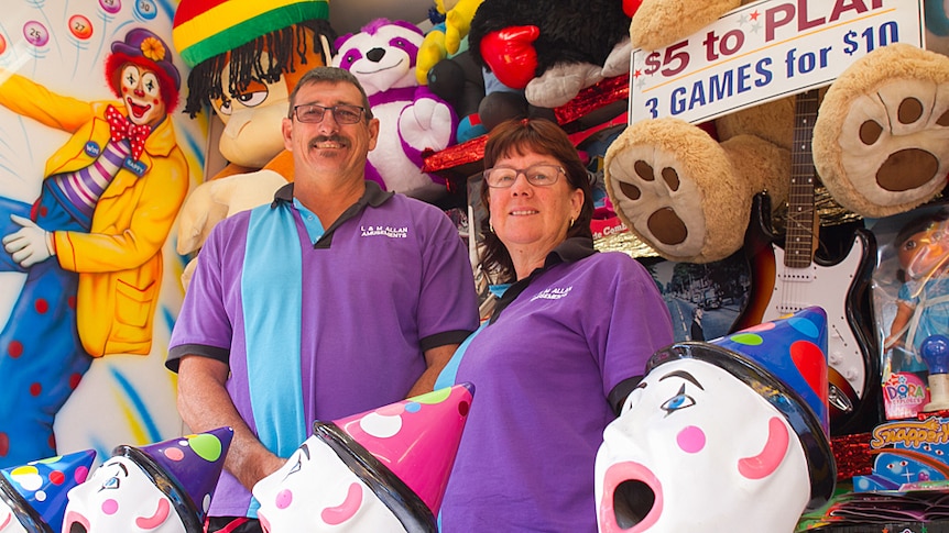 Mick and Leann Allen standing at their games stall at The Ekka in Brisbane.