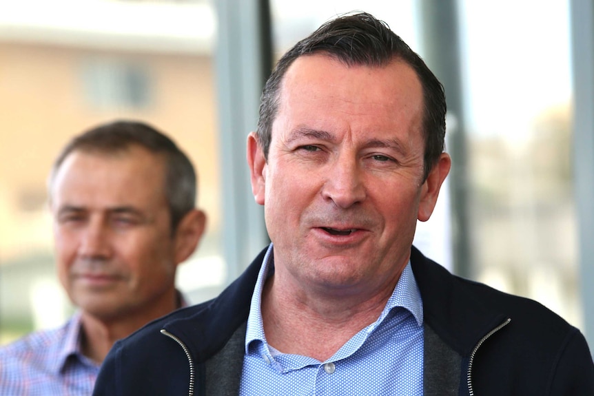 WA Premier Mark McGowan with a big grin on his face as he speaks outside his Rockingham office.