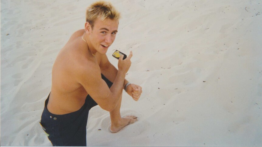Bombing victim Billy Hardy poses on the beach prior to his Bali trip