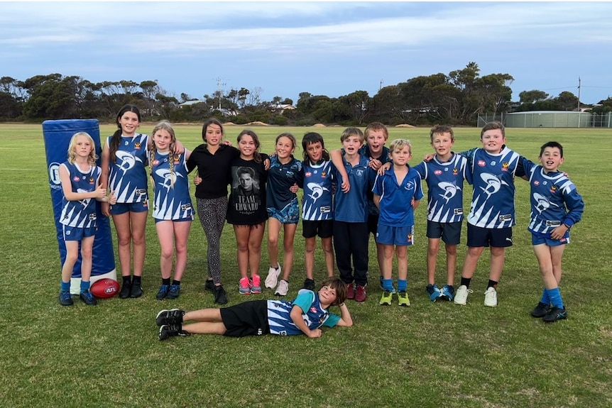 A group shot of a junior footy team