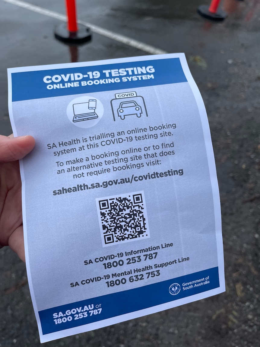 A notice advising of a booking system for coronavirus testing.