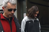 Harun Causevic and his father outside court