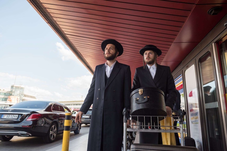 Actors Jeff Wilbusch and Amit Rahav as Orthodox Jewish men in Netflix series Unorthodox