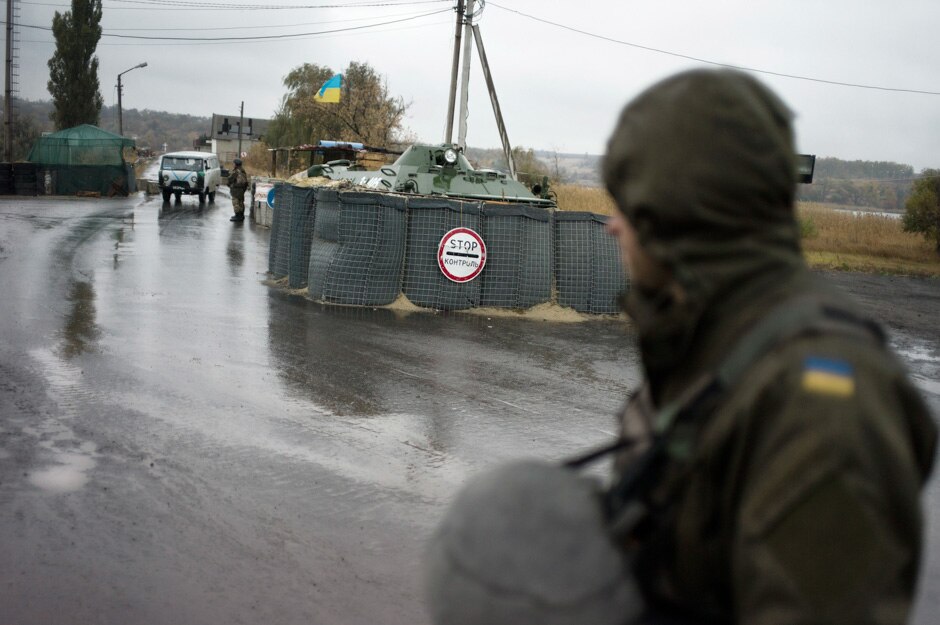 Soldiers man a traffic checkpoint sealing off the areas occupies by pro-Russian separatists.
