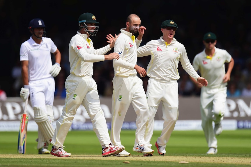 Nathan Lyon celebrates the wicket of Jos Buttler